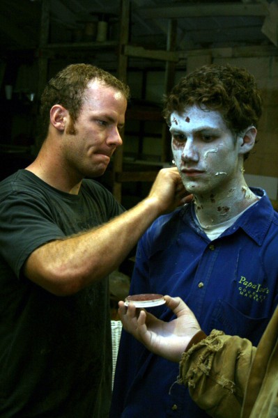 Drew applies makeup to Kale Davidoff, soon to be zombie extra.